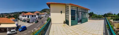 a building next to a street with a parking lot at CASA Da CERCA ACHADA De GAULA in Santa Cruz