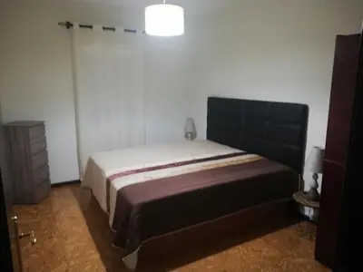 a bedroom with a large bed in a room at House Joel & Sonia with sea view in Funchal