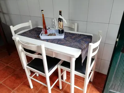 a table with two bottles and two glasses on it at House Joel & Sonia with sea view in Funchal