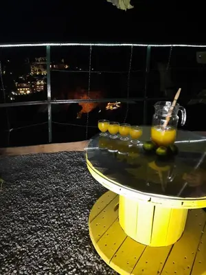 a yellow table with fruit on top of it at Encanto do Sol in Ponta do Sol
