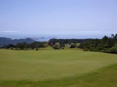 a view of the green at a golf course at Quinta Das Colmeias Cottage in Santo da Serra