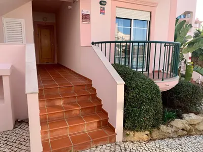 a staircase leading up to a house at St. James Beach & Pool Apartment in Luz