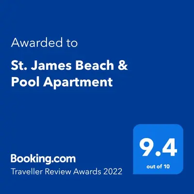 a blue sign that reads awarded to st james beach and pool apartment at St. James Beach & Pool Apartment in Luz
