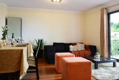 a living room with a couch and a table at Perola, a Home in Madeira in Funchal