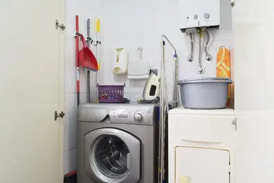a laundry room with a washer and a washer at Perola, a Home in Madeira in Funchal