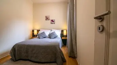 a bedroom with a bed with two pillows at Seaside House in Estreito in Estreito da Calheta
