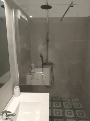 a bathroom with a shower and a sink at Souza Beach Apartment - Porto da Cruz - Studio & Suite in Porto da Cruz