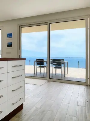 a kitchen with a view of the ocean at Holiday Apartment Ocean View in Ribeira Brava