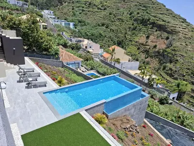 an image of a villa with a swimming pool at Apartamento MAR AZUL in Calheta