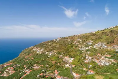 an aerial view of a hill near the ocean at Casa Mia, a Dream Spot With Heated Pool in Arco da Calheta