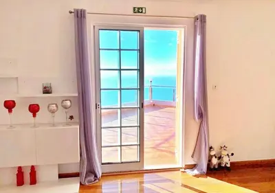an open door with a view of the ocean at Madeira Island Villa Oceane Ribeira Brava in Ribeira Brava