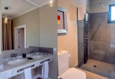 a bathroom with a sink and a shower at Number 15 Ocean & City View Villas in Funchal