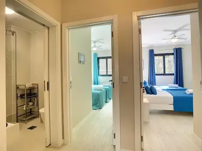 a bedroom with a bed and a mirror at Apartment Lotus by LovelyStay in Funchal