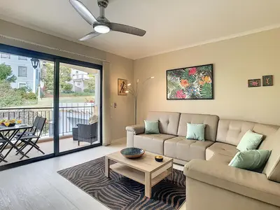 a living room with a couch and a table at Apartment Lotus by LovelyStay in Funchal