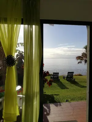 a view of the ocean from a fence at See to Sea in Santa Cruz