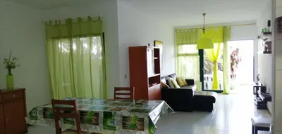 a kitchen and dining room with a table and chairs at See to Sea in Santa Cruz