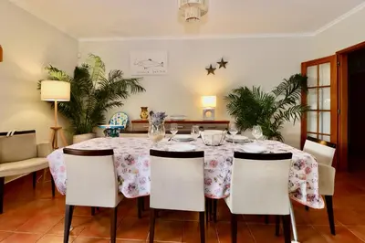 a dining room with a table and chairs at Casa das Ondas by AnaLodges in Porto Santo