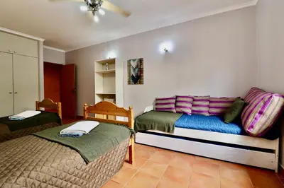 a bedroom with two beds in a room at Casa das Ondas by AnaLodges in Porto Santo