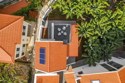 an overhead view of a house with an orange roof at Oscar's House by An Island Apart in Ponta do Sol