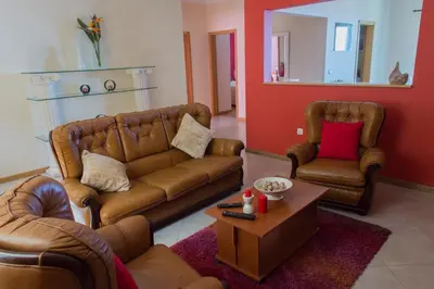 a living room with a couch and two chairs at “VENIK HOUSE” sea_mountains_relaxing_barbecue in Funchal