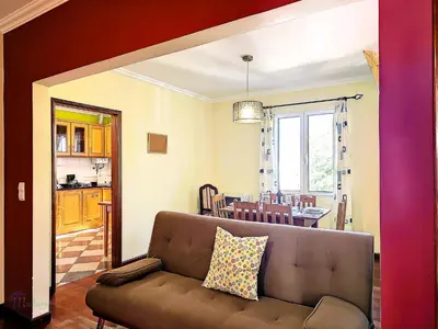 a living room with a couch and a table at Domus Dino in Porto da Cruz