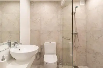 a bathroom with a shower and a toilet and a sink at Magnolia Apartment by Atlantic Holiday in Funchal