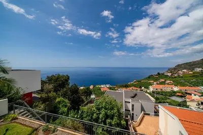 a view of the ocean from a city at OurMadeira - Amaro Sol in Calheta