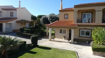 a house with a garden and a driveway at LakeView Boavista in Lagos