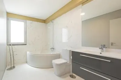 a bathroom with a tub and a toilet and a sink at Getaway to Blue Paradise at Madeira Island in Funchal