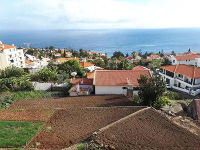 a view of a town with the ocean at Vista Mar in Caniço