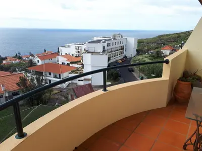 a balcony with a view of the ocean at Vista Mar in Caniço