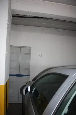 a garage with a car parked in front of it at Vista Mar in Caniço