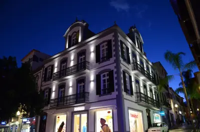 a white building with lights on the side of it at Edificio Charles 202 in Funchal