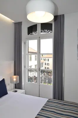 a bedroom with a bed and a window at Edificio Charles 202 in Funchal