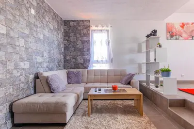 a living room with a couch and a table at Flowers Island house 2 in Funchal