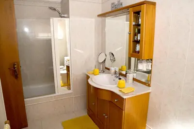 a bathroom with a sink and a shower at Charming house in Santa Cruz with sea view in Santa Cruz