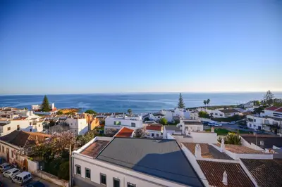 an aerial view of a town with the ocean at SEAFRONT LUZ APARTMENT in Luz