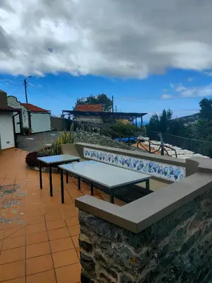 a row of picnic tables on a patio at Casa Maria Quinta 4 
