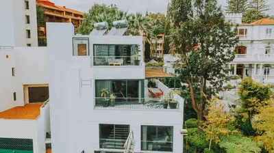 a white house with the letter e in it at FLH Casa Branca Madeira in Funchal
