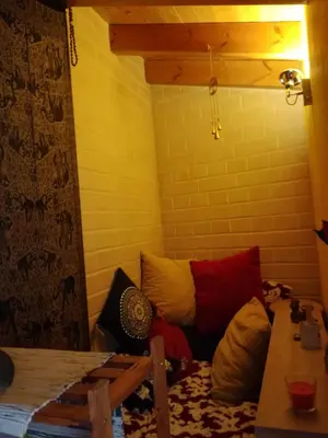 a room with a bunch of pillows on the floor at chabouco 2 (Mien) in Aljezur