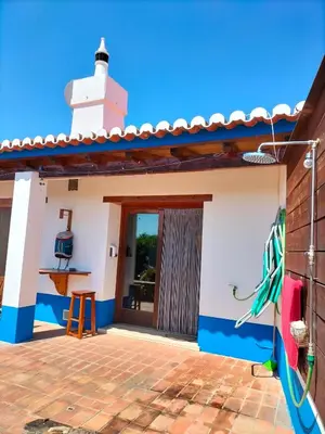 a view of the outside of a house with a lighthouse at chabouco 2 (Mien) in Aljezur