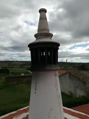 a black and white lighthouse on top of a building at chabouco 2 (Mien) in Aljezur