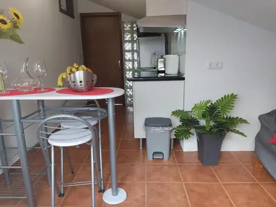 a kitchen with a table with a bowl of bananas on it at Tabua Village Madeira Suite 5 Nature Lovers in Ribeira Brava