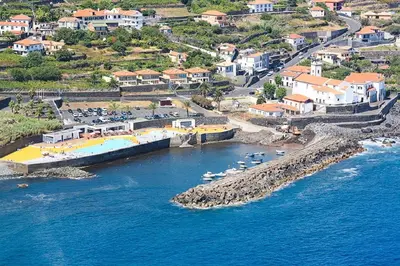 an aerial view of a beach with boats in the water at Cottage Quinze & Apartment with Swimming pool in Ponta Delgada