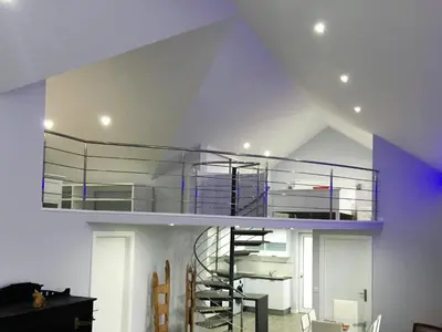 a room with a spiral staircase in the ceiling at Cottage Quinze & Apartment with Swimming pool in Ponta Delgada
