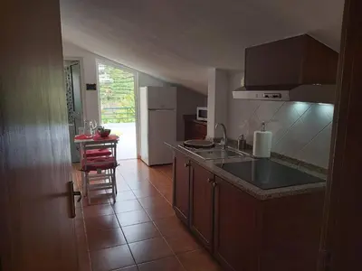 a kitchen with a sink and a counter top at Tabua Village Madeira Suite 6 Adventure with Ocean View in Ribeira Brava