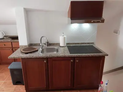 a kitchen with a sink and a counter top at Tabua Village Madeira Suite 6 Adventure with Ocean View in Ribeira Brava