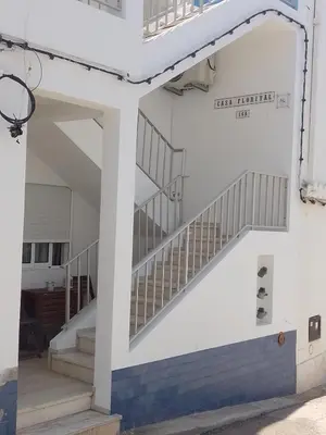 a view of the stairs to the second floor of the building at Casa Florival in Burgau