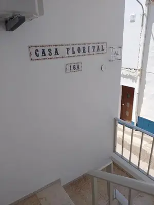 a street sign on the side of a building at Casa Florival in Burgau