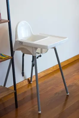 a white desk on a metal stand on a wooden floor at Acacia Apartment by Atlântica in Funchal